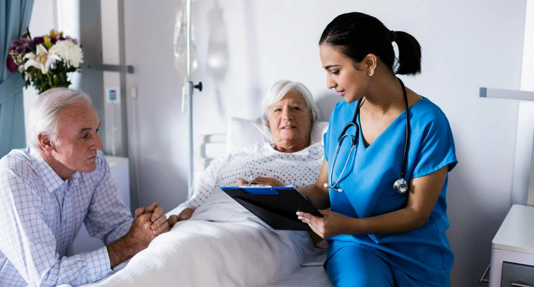 Healthcare professional supporting elderly patient during care transition